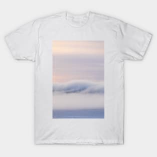 Dreamy thick fog at sunrise over hill T-Shirt